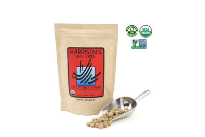 A 454g bag of Harrison's High Potency Coarse, next to a metal scoop full of the nuggets